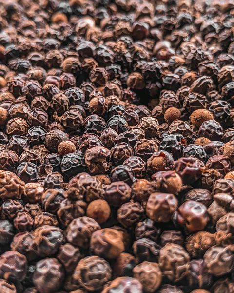 Whole black peppercorns